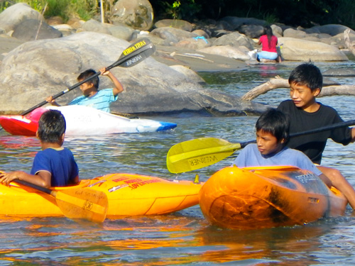 kids playing in the napo river tena, ecuador